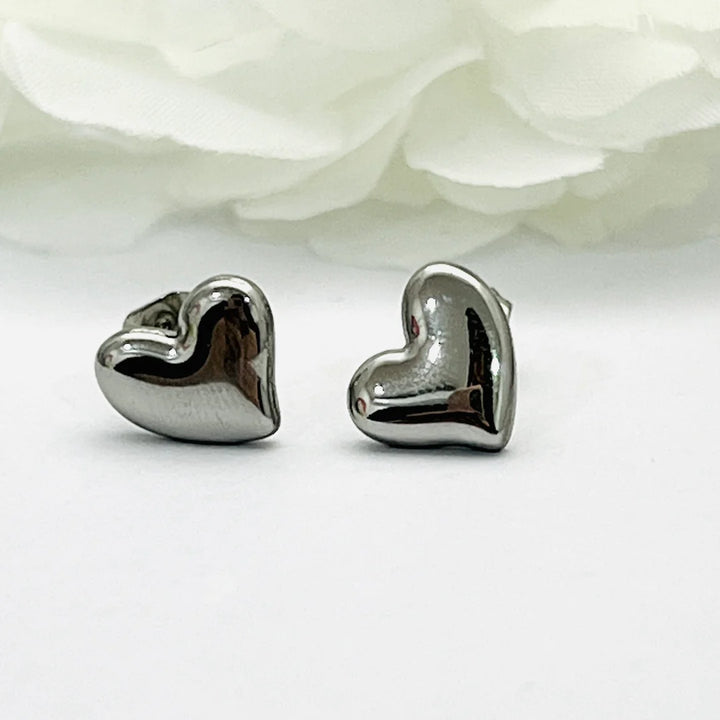 Aretes de Acero Corazón de Luz Plateada