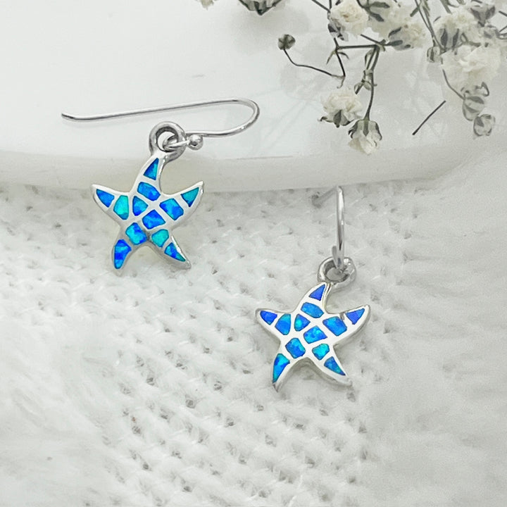 Compra en línea hermosos aretes de estrella de mar en plata con ópalo