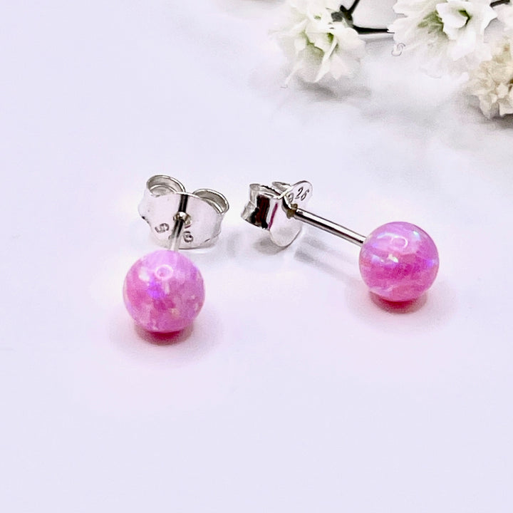 Compra online unos hermosos de aretes redondos con la piedra ópalo 💙 en Costa Rica 🇨🇷