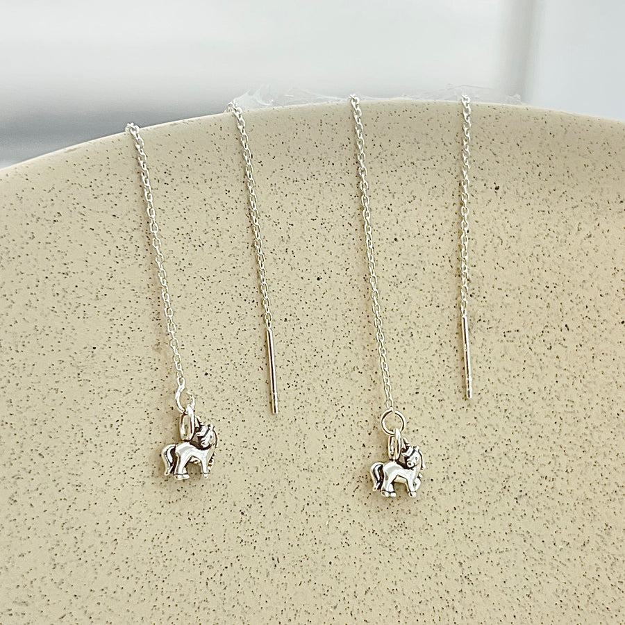 Compra online aretes de plata con lindos unicornios en Nicola Joyeria 